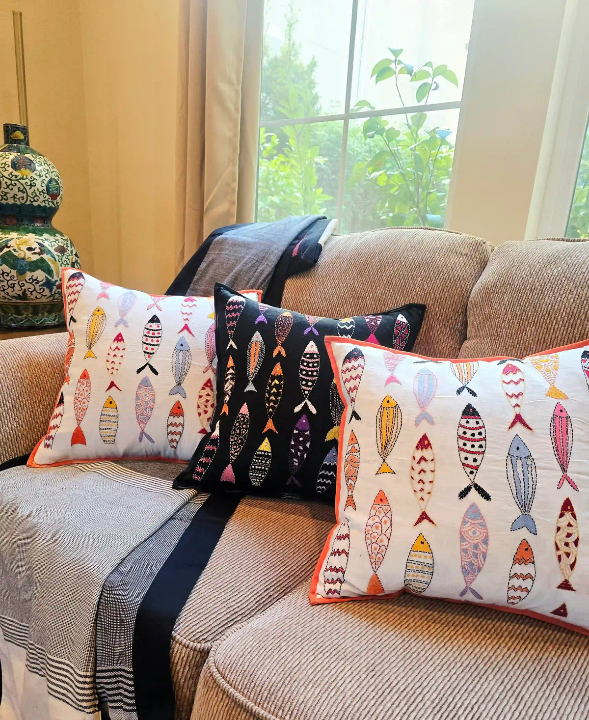 Kantha fish cushion cover styled on sofa