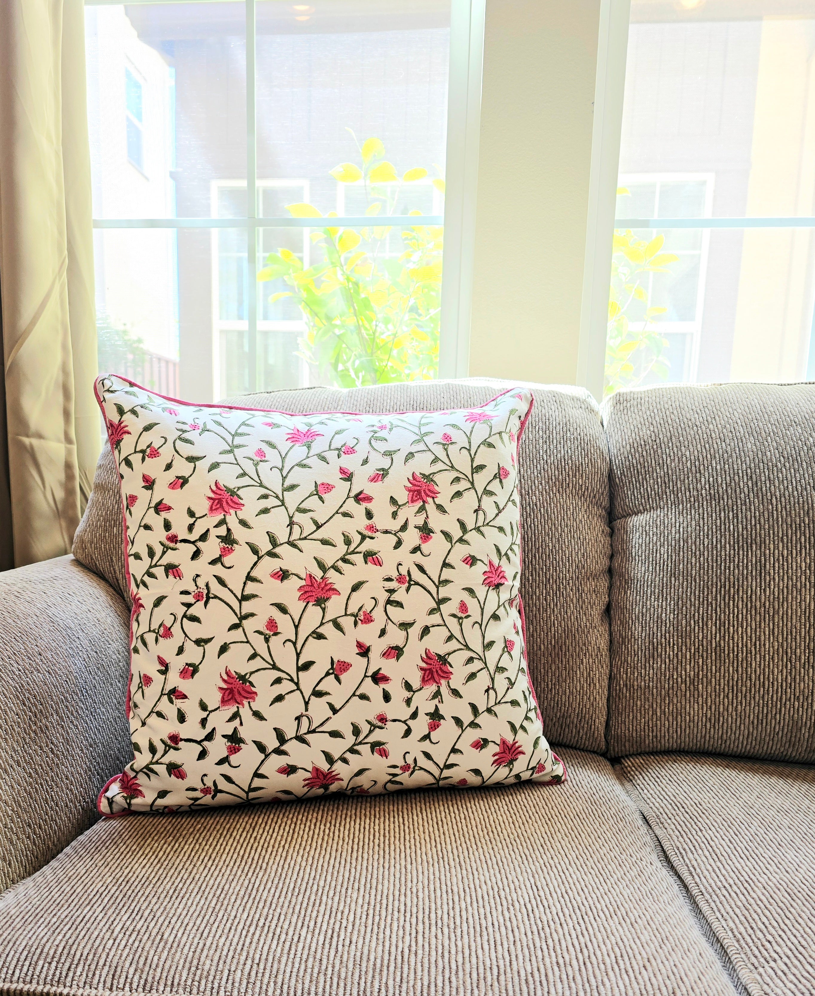 Cushion covered with floral printed cushion cover