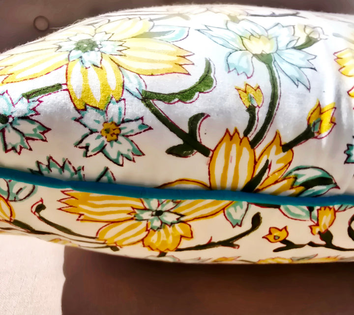 closeup of the yellow floral print of a cushion cover