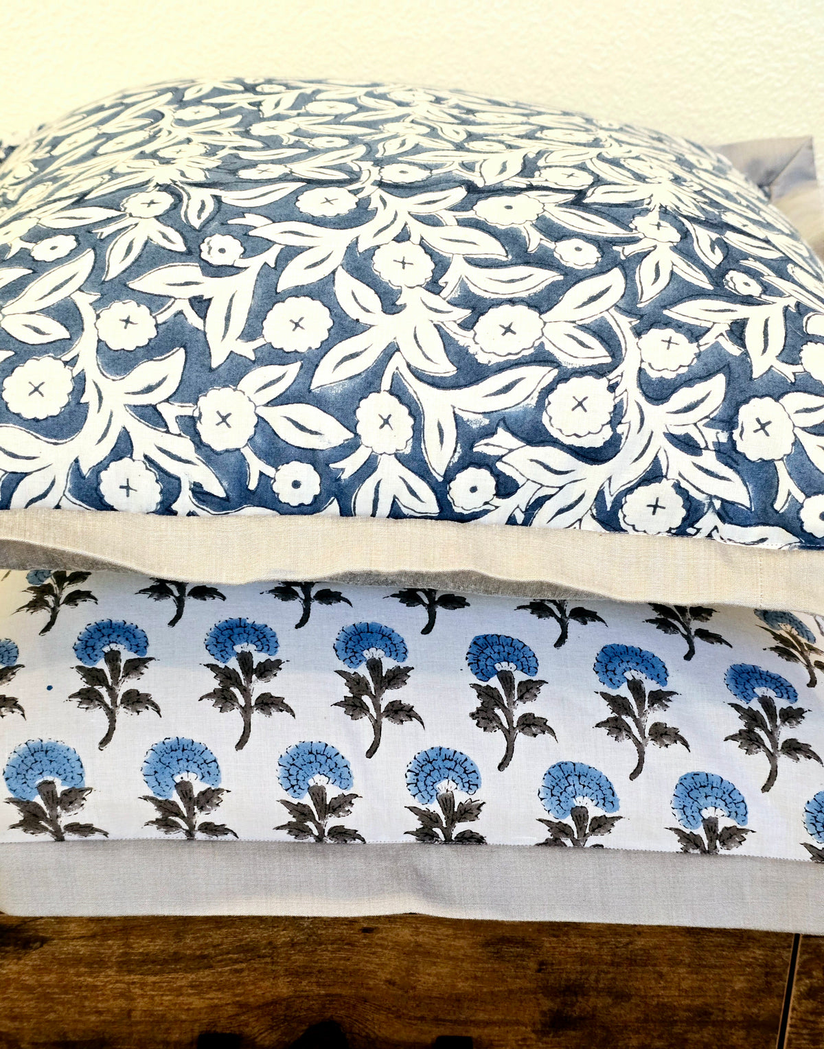 close up photo of blue floral print on cushion cover