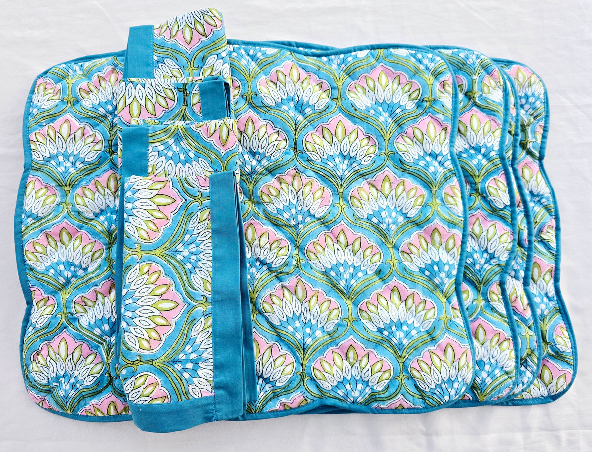 Set of blue floral cotton quilted scalloped placemats and matching napkins