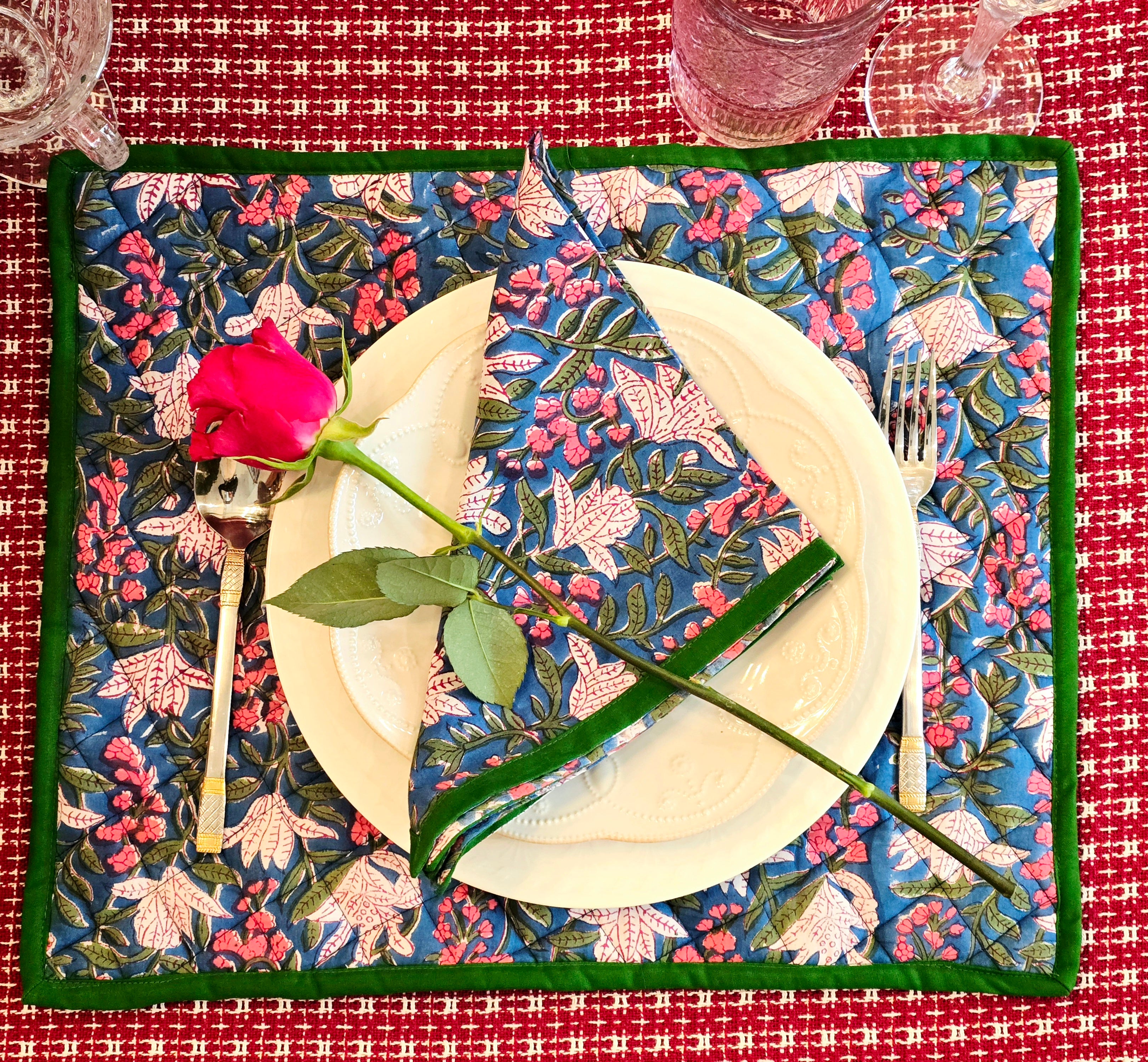 Floral blue quilted cotton placemat styled on dining table setting