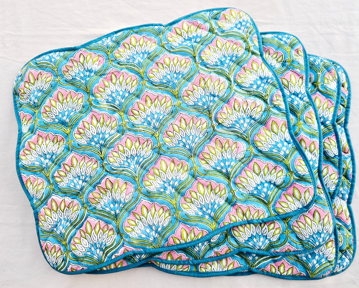 Set of blue floral cotton quilted placemats with scalloped sides
