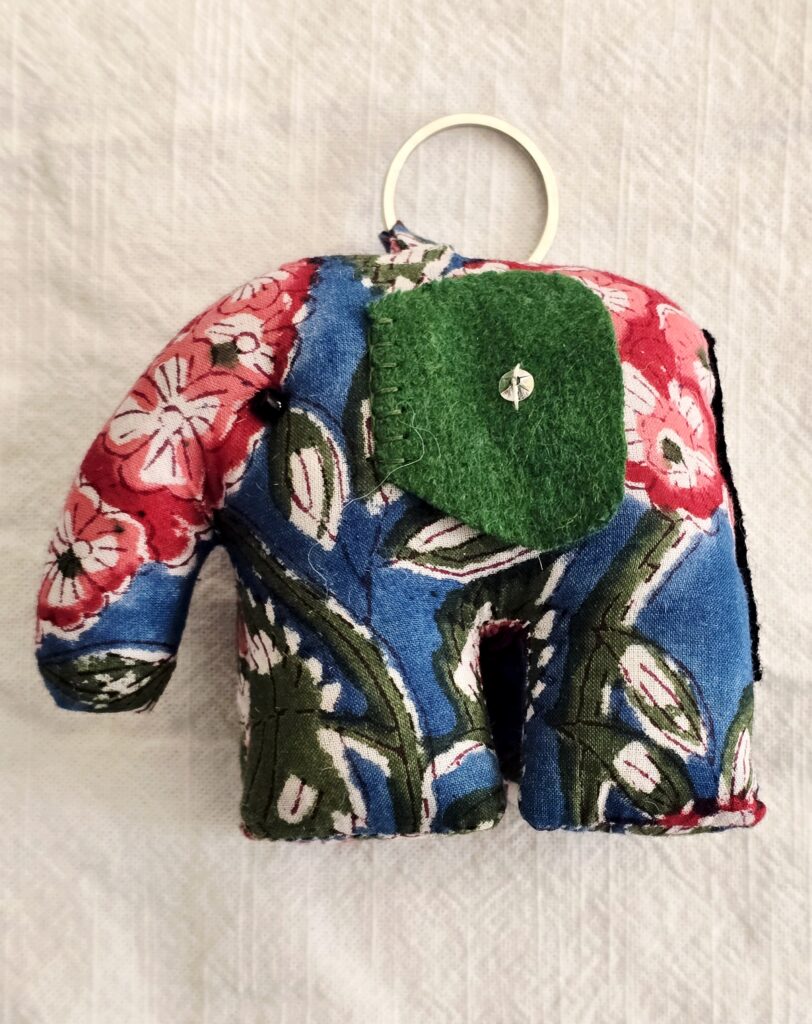 Handcrafted soft toys made from upcycled, naturally dyed cotton fabrics in earthy tones, highlighting sustainable reuse of textile remnants.