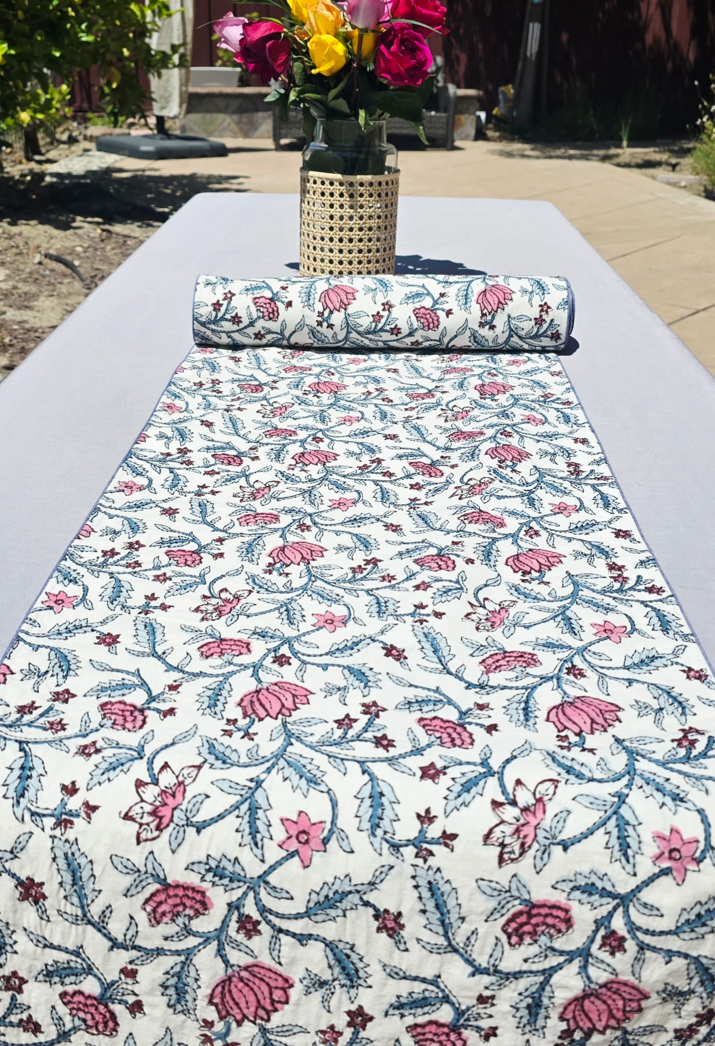 Hand block printed embroidered cotton table runner in pink floral on white – ethically made by artisans at Ohana Earth